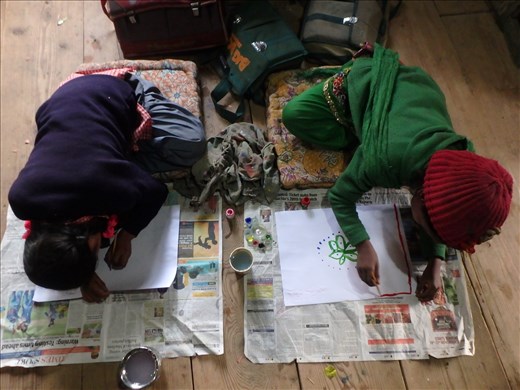 Divaya & Rehka are both excellent at art. In this shot they refused to sit with the other kids at the desk but have instead etched out a place for themselves on the floor so they could concentrate.