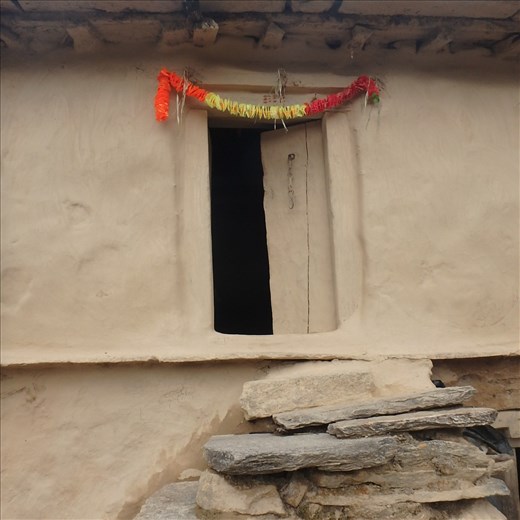 The doorway to a traditional Kumaoni house in rural India, Jatoli (2400m). Some buildings are one hundred years old and the small windows and doorways reflect an age where 'small was good' for heat retention in a cold climate.