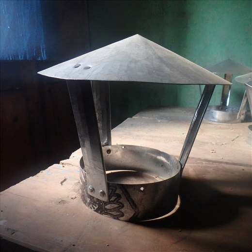 A sample of a hand made cowl that will be placed on the outside of a building on top the chulha flue. The locals call them 'topi wallahs'....