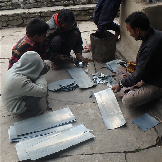 The top of the chulha has two holes to place pots/kettles on for cooking, when not in use they needed a cover. The villagers decided that galvanised flat iron would be great for the job. And they were right!