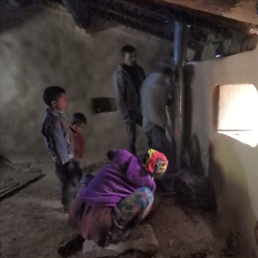 The 'team' working on chulha (stove) installation.