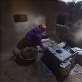 Dana is lovingly applying 'lal mart' or red clay. This rendering of the stove is practical by rounding off edges and aesthetically beautiful.: by bonnie, Views[420]