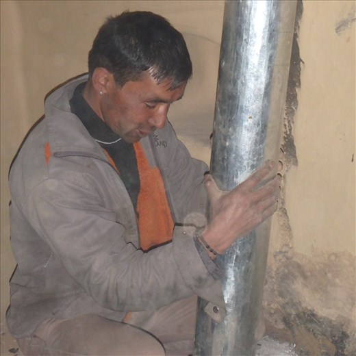 Digember positioning a flue.