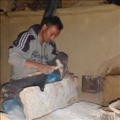 Working with sedimentary rock Dinesh is fashioning holes for the stove top.: by bonnie, Views[397]