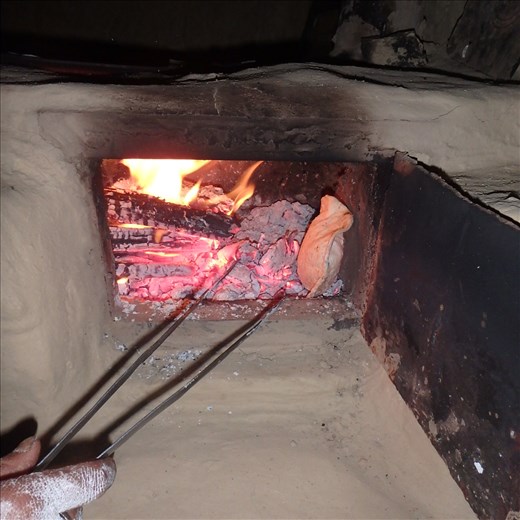 The roti (unleavened bread - the nightly staple) is cooked on the stove top on a 'toy' (metal pan) then finished of on a bed of coals. This is why a two door chulha system was applicable to the local environment/cooking.