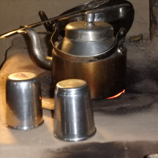 Making a cup of tea post chulha installation (note the clean atmosphere!)