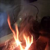 Making a cup of tea on an open fire that is positioned in the centre of a room: by bonnie, Views[517]