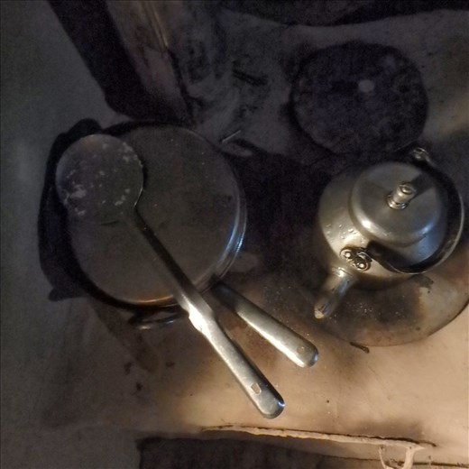 Looking down on a stove top in use....