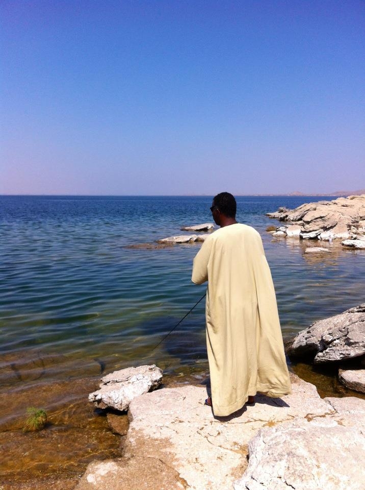 Our Nubian Tour guide fishing on our last day for a Nile for his family 4 dinner