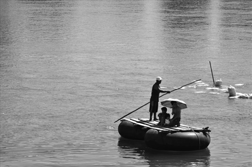 Most women cross the border everyday in search for a job to support their children, this woman is getting close to the mexican frontier over the river. 