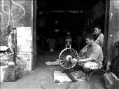 In a remote province in the Philippines where motorcycle is the common mode of transportation. This fixes a motorcycle rim while his colleagues watch TV on a slow day.: by borg, Views[405]