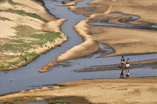Shallow river bed offers even merriment for tribal children during morning