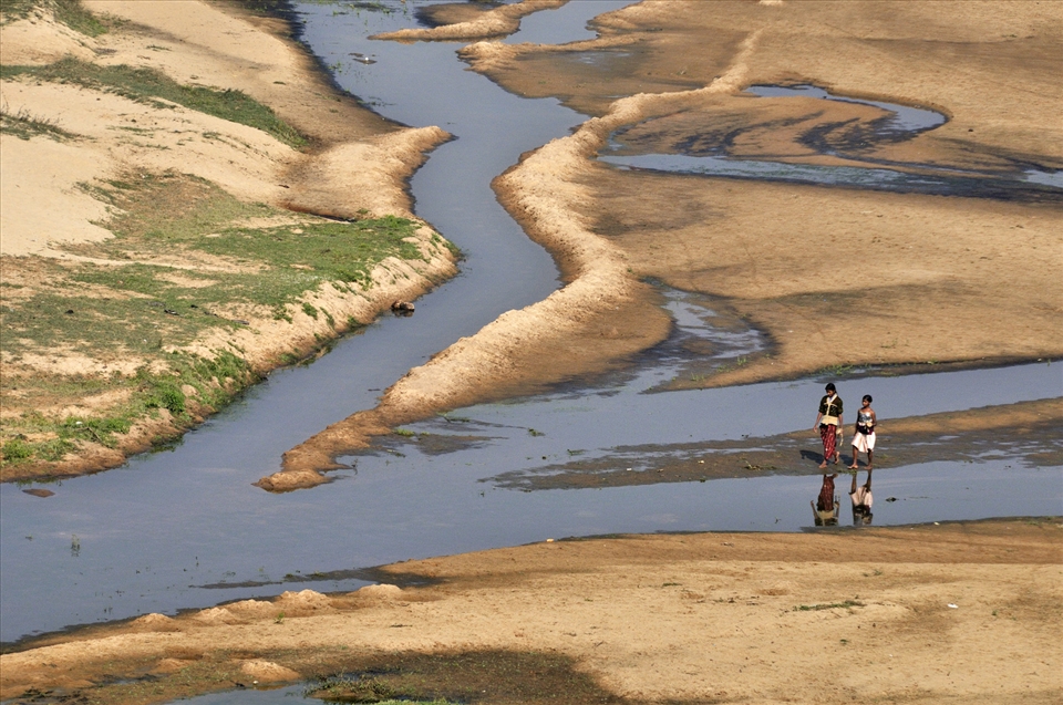 Shallow river bed offers even merriment for tribal children during morning