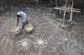 An old lady places buskets on earthern floor decorated with hand made designs : by bpatra, Views[335]