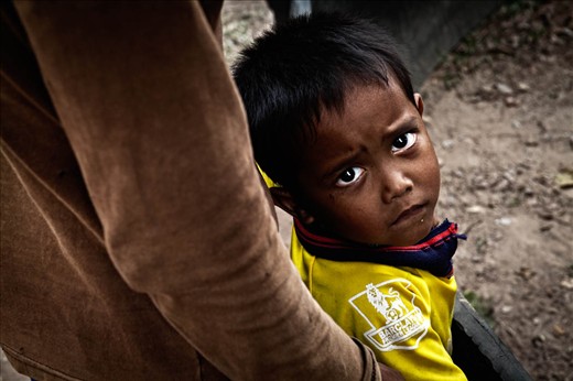 Father and Child about to watch cock fight. Don Det, Laos.