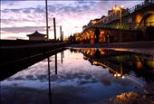 Brighton dreaming: Most people would either be arrested or hospitalised for willingly lying stomach-down on the promenade of stony Brighton beach in freezing wind wind conditions. I had popped out of my hostel quickly in less than weather-appropriate clothing to buy a snack when I saw the sunset approaching. I ran down to the promenade were I came across this puddle, and risking hypothermia, this is where i stayed until the sunset left- clicking away at my camera whilst curious locals and tourists cast me strange looks. Why was she photographing a puddle? Australia was in drought, but had she really been this deprived of rainwater? The result was beautiful, but it took me several cups of tea and a night in bed to bring warmth back to my body. Once again though- it was a moment that inevitably needed to be captured.: by breewilkinson, Views[292]