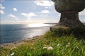 The fortress: From the windy tops of a Pirate fortress standing lone in the bay of Penzance, I sat in an alcove in the sun after completing my climb and took a photo across the bay. St. Michaels mount is a glorious establishment like no other. Jutting out monumentally from the sea, you feel the sense of inferiority when you stand beneath it, and the sense of power when you stand atop. You imagine you are Cornish royalty on the battletops lined by rows of cannons, imagining what it would have looked like to see notorious Pirate vessels sail into the bay. each window looks out into wide and endless sea, and inside lies a fortress which evokes true mystery and wonderment. This photo represents my experience of hiding away on this ancient structure, looking out toward the sea. It is a precious memory and i am so happy i captured it.: by breewilkinson, Views[524]