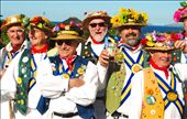 Merry Men: Returning to the town of my ancestors, St. Agnes, on a gorgeous Cornish afternoon, I came across these jolly Morris men dancing in the middle of the street. I started snapping away with my camera- and then asked the leader if i could have a photo of him. He gave me one look and pulled out a large whistle. Immediately after blowing it, he called his troops to attention. 