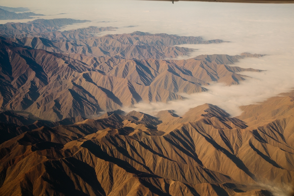 High above the dramatic and foggy Andes mountains