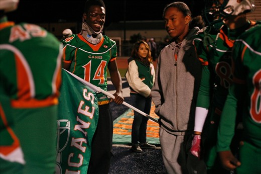 Trevon Fennell, senior, was struck by a car while walking on the sidewalk from school, sidelining him from playing in the playoff game. His teammates still rallied behind him, following him at the start of the game as he carried the team's flag.