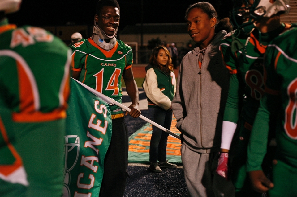 Trevon Fennell, senior, was struck by a car while walking on the sidewalk from school, sidelining him from playing in the playoff game. His teammates still rallied behind him, following him at the start of the game as he carried the team's flag.