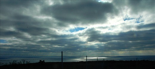 Nature is fenced off and distanced to us. Natural 'god rays' kiss the water, yet we are prohibited by ourselves from capturing the moment in its natural state. 