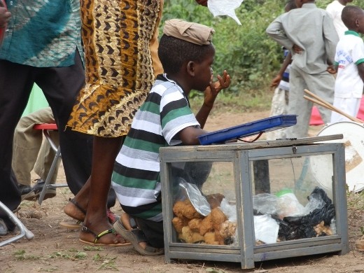 A boy selling a local snack at the orphange school at Tutu in Ghana.