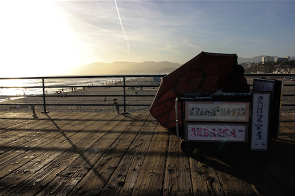A vendor working the boardwalk at the Santa Monica pier in California 