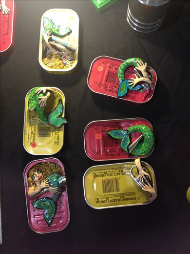 Modern/Alternative art gallery in Hotel de' Ville in Paris. tinned mermaids!