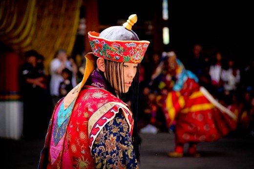 A Quiet Moment - The facial expression of this monk dressed up in a festival costume is potrays a moment of inner silence in contrast with the whirlwind of sound and movement around him.