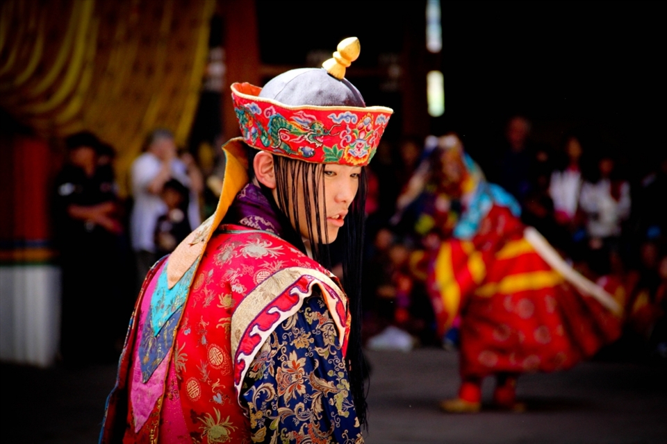 A Quiet Moment - The facial expression of this monk dressed up in a festival costume is potrays a moment of inner silence in contrast with the whirlwind of sound and movement around him.