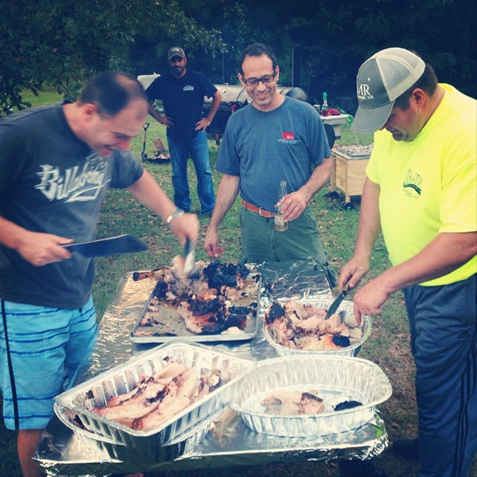 The Australian 5 star chef carving up the hog while I drink a beer