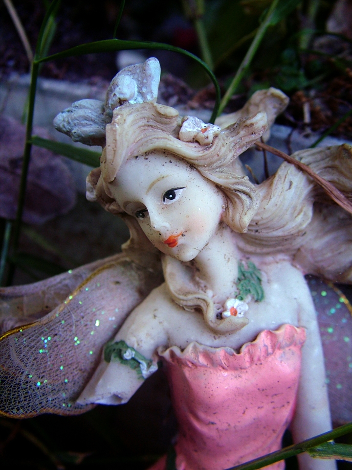 On the outskirts of a cemetery in North London, she sits beside the grave of a little girl lost