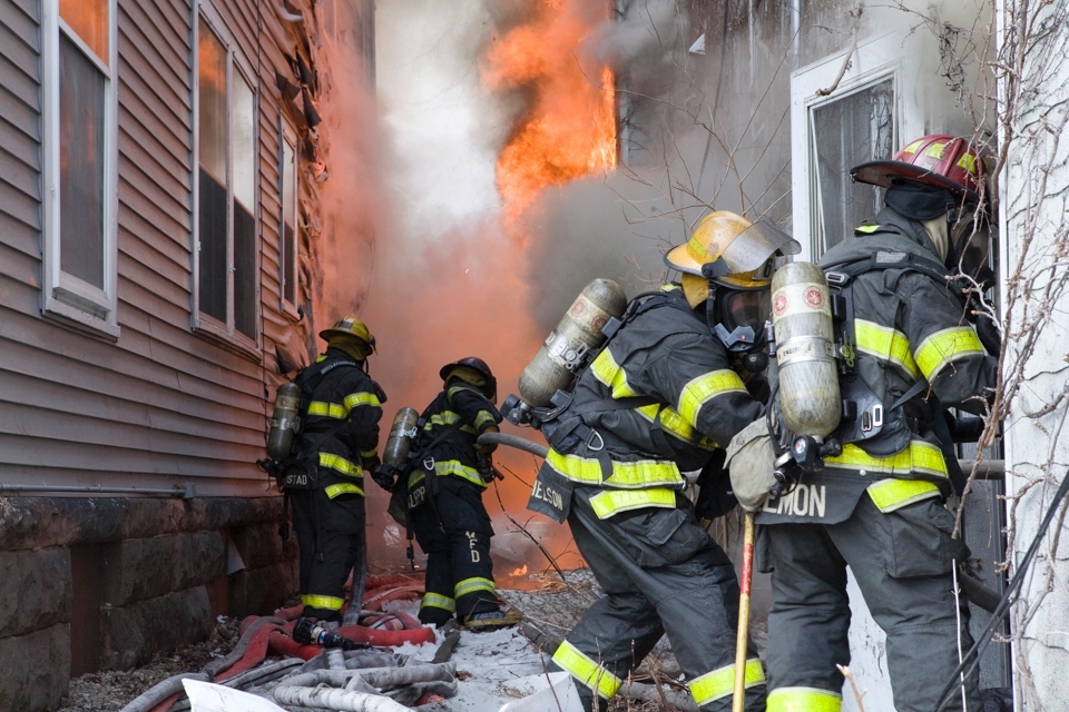 As the flames grow, firefighters work hard to tame, and put the blaze to rest.