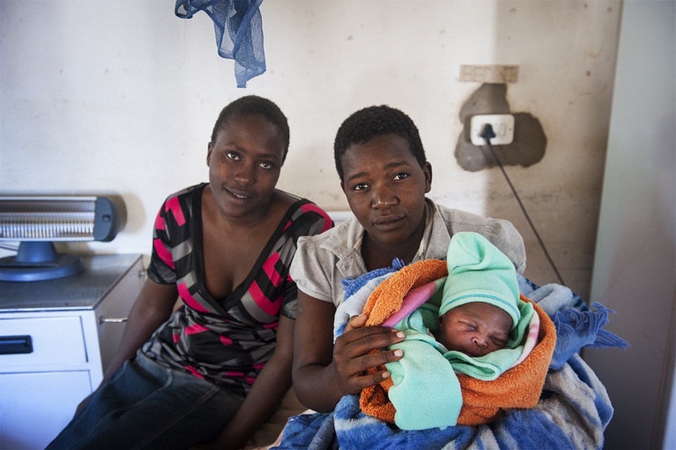 Success! A healthy baby born at 3 am the night before is comforted by her mother and Aunt. This is becoming a more common occurrence now, and word is spreading throughout villages that the health clinics are a valuable asset to the local people.