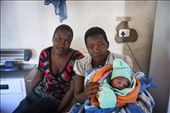 Success! A healthy baby born at 3 am the night before is comforted by her mother and Aunt. This is becoming a more common occurrence now, and word is spreading throughout villages that the health clinics are a valuable asset to the local people.: by bryceworld, Views[482]