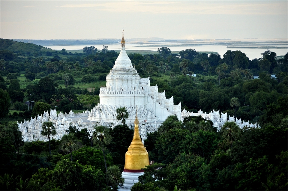 The Mya Thein Dan Pagoda, a holy place where the shepherd,  the cows, the prayers, and the monks are united to divinity.
