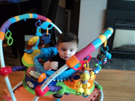 Chase in his bouncer - very contented