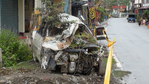 A car in Nansalu wrecked in the mudslide