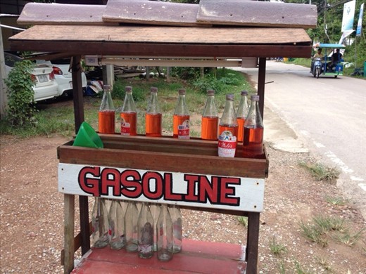Glass bottles of petrol for sale on roadside