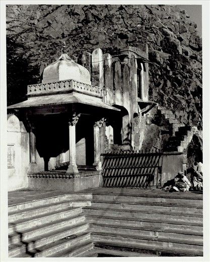Within the confines of the Temple acreage is this small structure, below which are stairs down to a sacred pool. Above it are more stairs leading up to a mysterious door carved into the rock face and forgotten in time.