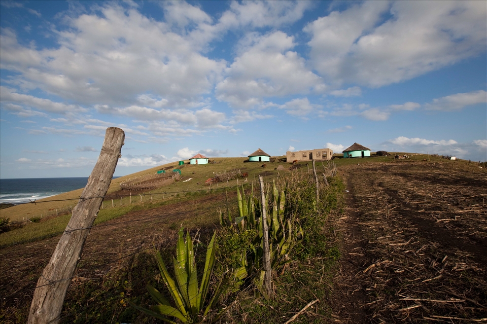Homes, half built schools and land for labour