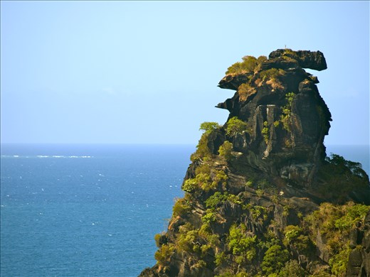 'La Poule', an oddly-shaped rock formation guards the coastal town of Hienghene