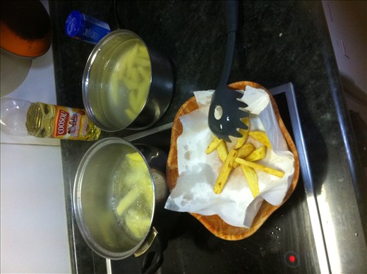 frying the potatoes
