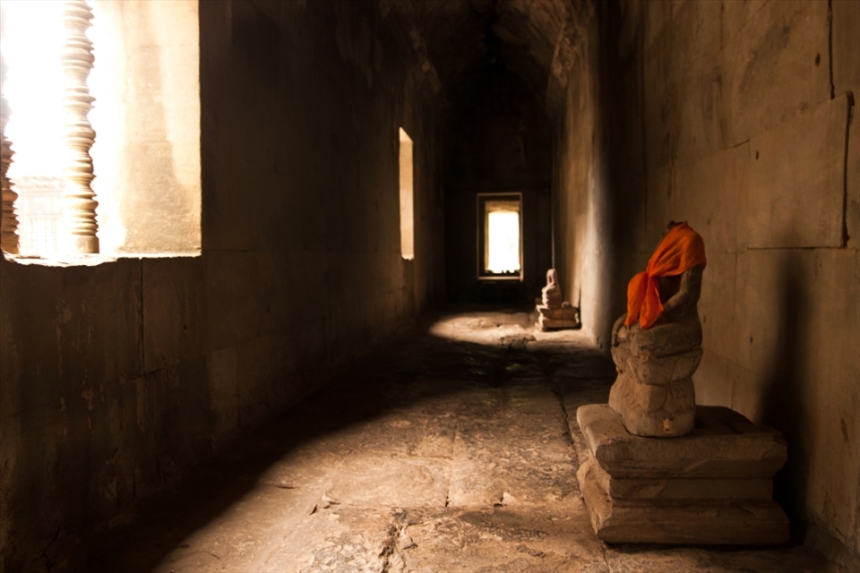 Inside of Angkor Wat, it was a hall way with great lights that illuminate what's left of the statues.