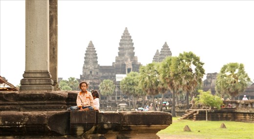 Young children playing in front of the Angkor Wat, they appeared to be from poor families living near the Wat and rely on tourism to earn an income.
