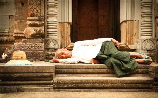 This lady was taking a nap at in front of a small temple in the Angkor Wat complex. It was mid day and looks like she already needed a rest.