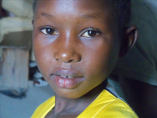 Pierced. The soft face of a young boy show the vitality of his youth.