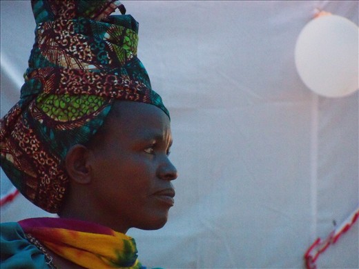 Array. Child-rearing starts early in Sukuma culture. This young woman has eight children.