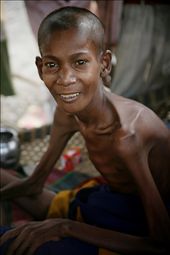 The family of this youth insisted on this photo, he was dying of AIDS, he smiles for the photo, but the sadness of the moment is forever burnt into my mind. Capturing the image of this boy because his family and loved ones didn't want him forgotten, they wanted his story told.: by camillenelson, Views[309]